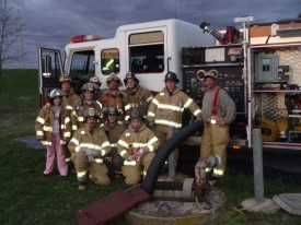 A crew from Station 28 takes time out to pose for a shot during pumps training. 